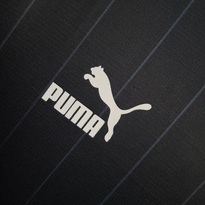NEW ZEALAND 2026 HOME - Puma logo on black merchandise, perfect for fans gearing up for the upcoming season.